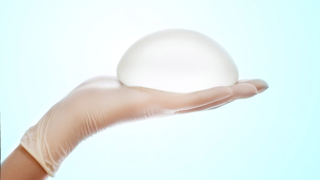 Silicone Breast Implant On Hands | Dr. César Padilla, Málaga