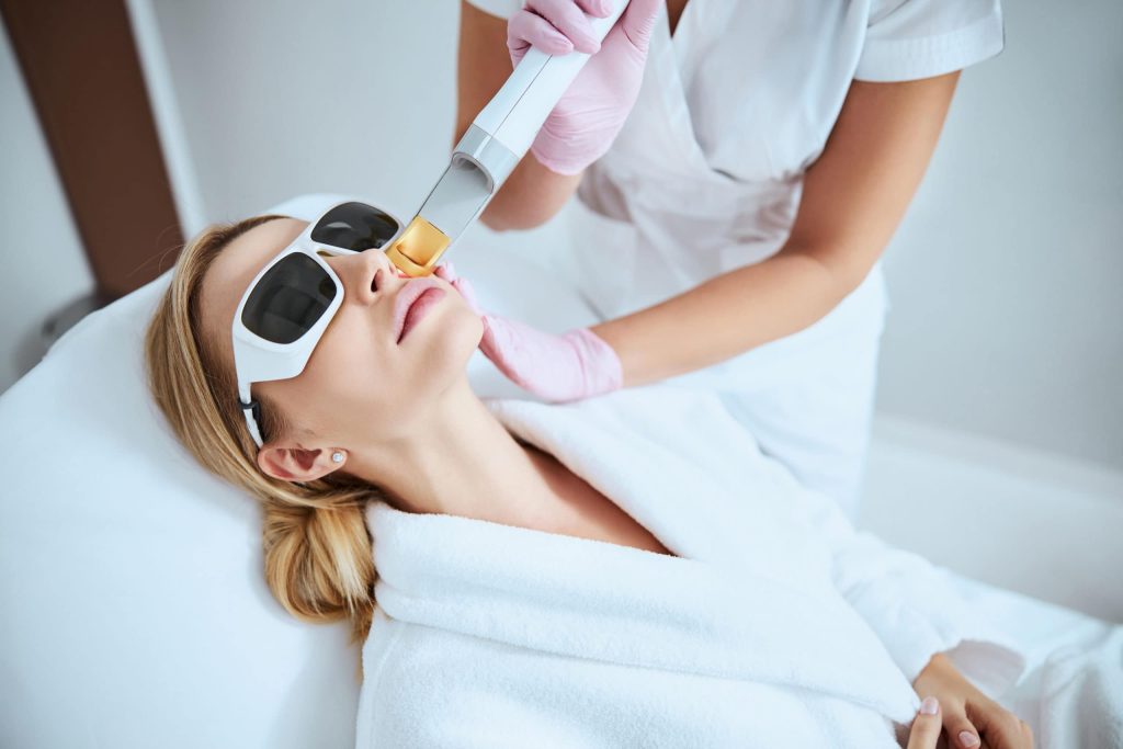 Woman Undergoing The Fractional Laser Skin Treatment | Dr. César Padilla, Málaga