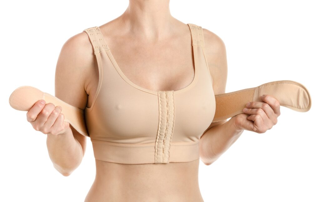 Compressing bra with a stipe after breast augmenta 2026 03 17 17 12 57 utc